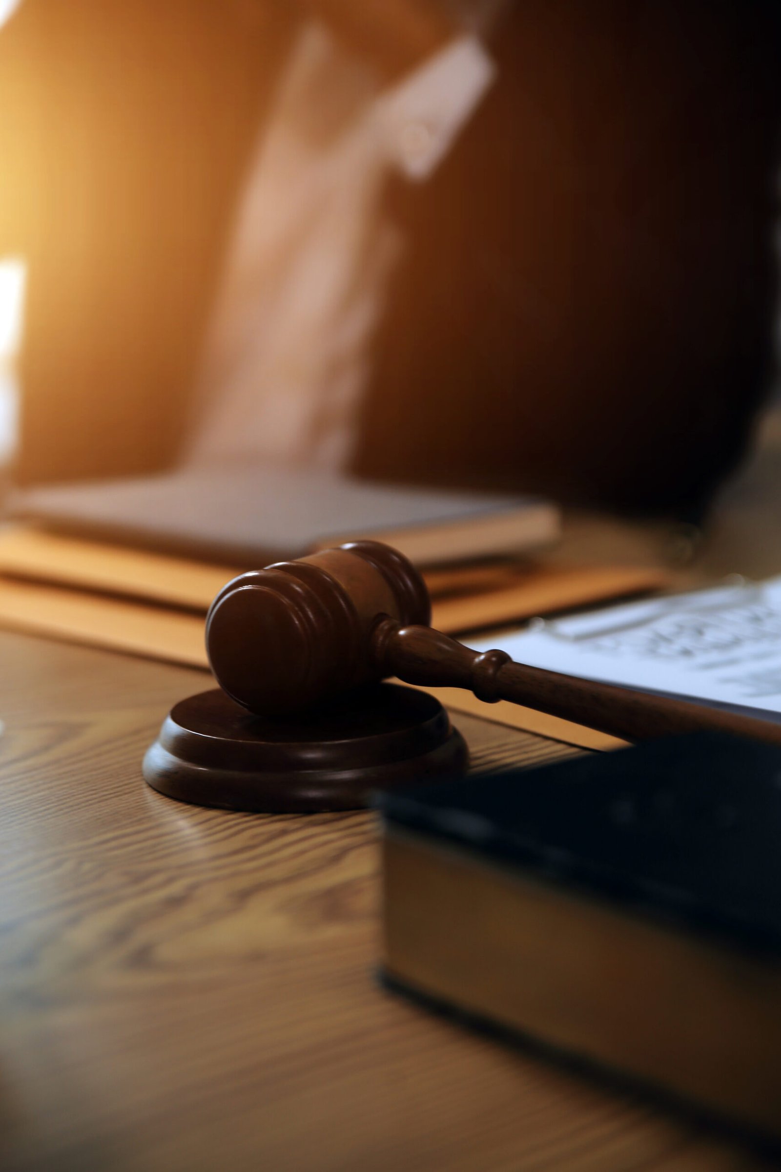 judge gavel with justice lawyers having team meeting at law firm